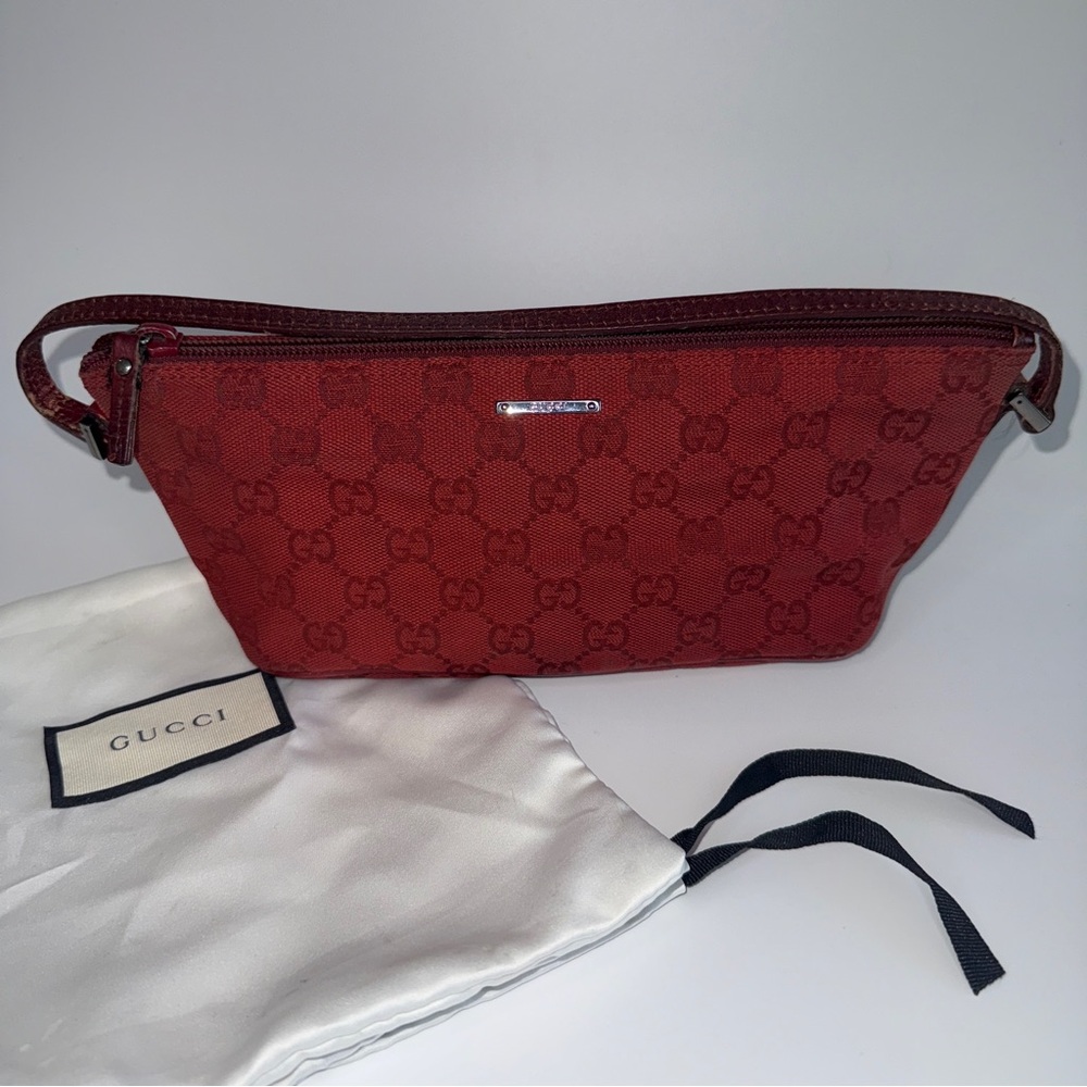 SOLD. Gucci Monogram Boat Pochette in dark red